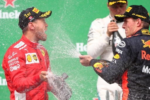 Vetttel claims 50th win and goes top in title race
