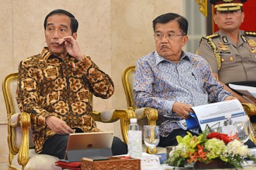 President Joko "Jokowi" Widodo (left) and Vice President Jusuf Kalla. Who is going to sit next to Jokowi in 2019?