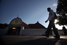 A man walks past the mosque. JP/Boy T. Harjanto