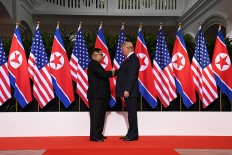 Trump's national security adviser back in fold at Kim summit
