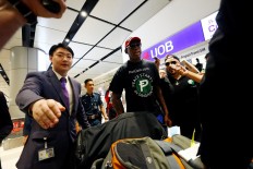 Former sports star Rodman weeps during interview on sidelines of Trump-Kim summit