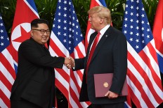Trump, Kim sign 'comprehensive document'