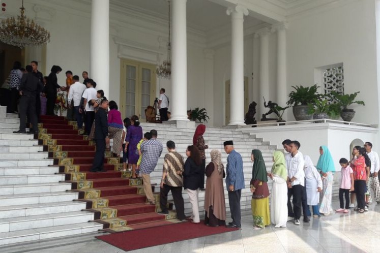 Thousands of visitors line up from the early morning on the day of Idul Fitri to join an open house event at the Bogor Palace in West Java in 2018.