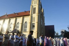 Religious harmony shown on Idul Fitri in Semarang, Malang