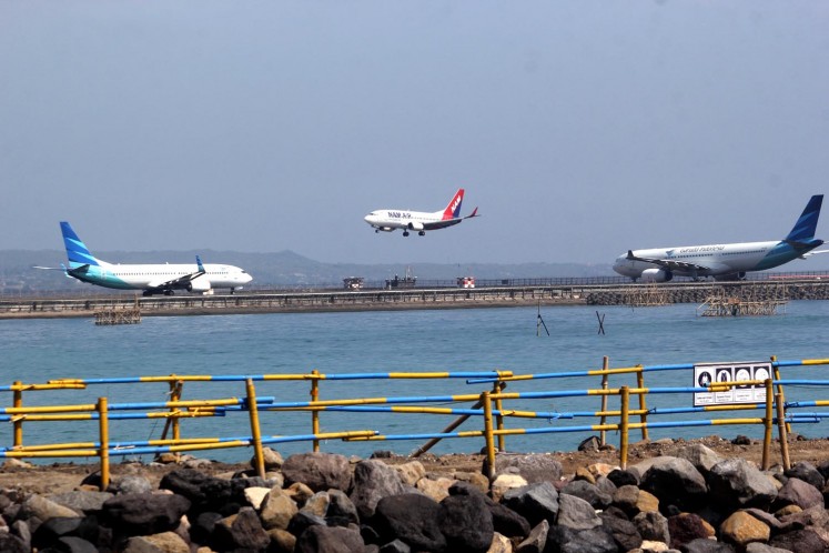 To the skies: Planes prepare for take off at I Gusti Ngurah Rai International Airport in Bali. The airport will serve 724 extra flights for this year’s holiday season. JP/Zul Trio Anggono