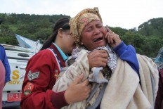 Indonesia lists 180 missing on doomed ferry, launches underwater search