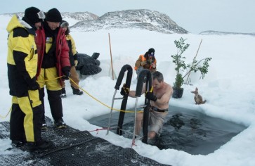 Antarctic researchers mark winter solstice with icy plunge