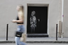 New 'Banksy' mural appears next to Bataclan in Paris