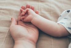 Despite a common belief that allowing babies to sleep in the parental bedroom encourages a baby's dependency on their parents, research published last year suggested that babies who sleep in their parents' bedroom for the first six months of life have no increased risk of sleeping problems or behavioral problems later in childhood at age six to eight.
