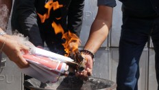 Officials incinerate damaged ballots in Denpasar, Bali, on Tuesday. 