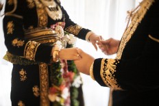 From raincoats to video calls, COVID-19 adds unusual wrinkle to typical Indonesian weddings