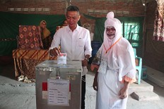 General Elections Commission official Wahyu Setiawan casts his vote at a ghost-themed polling station in Randusari subdistrict, South Semarang district, Central Java, on June 27.

