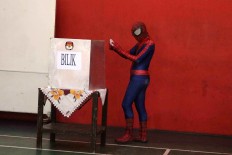 “Spiderman” casts his vote in the Central Java gubernatorial election in Larangan Gayam subdistrict, Sukoharjo regency, Central Java on Wednesday, June 27, 2018. JP/ Maksum Nur Fauzan