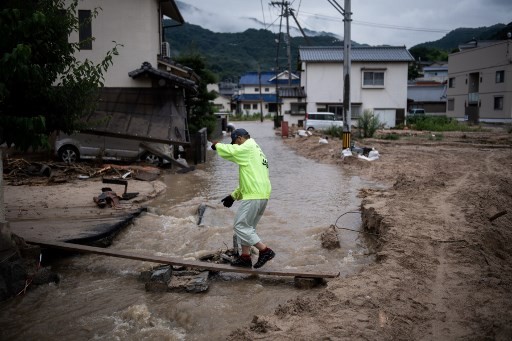 Official death toll from record Japan rains rises to 75