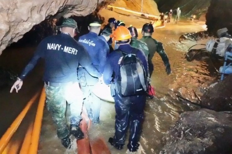 This handout video grab taken from footage released by the Royal Thai Navy on July 11, 2018 shows rescue personnel during the rescue operation for members of the 'Wild Boars' Thai youth football team inside the Tham Luang cave in Khun Nam Nang Non Forest Park in Mae Sai district. The rescue mission is to get the Hollywood treatment in a movie announced by production house Pure Flix.