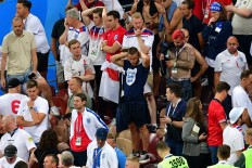 England fans nurse soccer heartbreak with 'Don't Look Back in Anger'