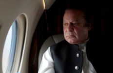 Ex-PM Sharif heads to Pakistan to face jail before elections