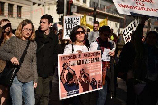 Demonstrators march during a protest to demand humane treatment of asylum seekers and refugees, in Sydney on July 21, 2018. Australia's detention of asylum-seekers on the remote Pacific islands of Nauru and Papua New Guinea's Manus has drawn international criticism after news of alleged widespread abuse and an 