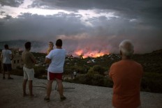 At least 20 dead in Greek wildfires