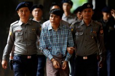 Black hoods, kneeling, no sleep: Reuters reporter details Myanmar custody