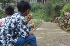 In this tobacco village, smoking 'kretek' is rite of passage