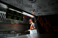 Burger on wheels: Saudis try once 'lowly' jobs as economy bites
