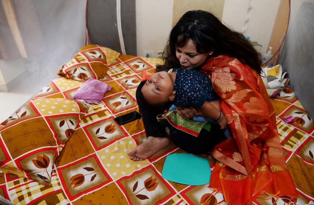 indian women breastfeeding their husband