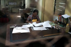 A clerk maintains records for PD Taru Martani. JP/Magnus Hendratmo