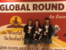 Nadya Annabelle Lumy (left), Putri Aimee Srijaya (center) and Erin Michelle, students of National High Jakarta School, hold trophies they won at the World Scholar's Cup in Barcelona, Spain.