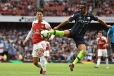 Guardiola salutes City's sacrifice as champs subdue Arsenal