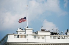 Trump, under pressure to honor McCain, orders flags to half-staff