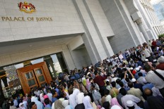 Malaysia Islamic court postpones caning of women for lesbian sex