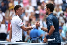Djokovic in survival mode as heat delivers beating at US Open