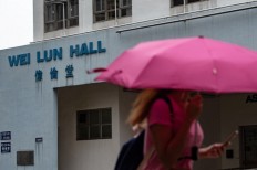 Hong Kong professor arrested for murder after body found in suitcase