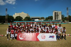 Happy players: Young soccer players in Manado, North Sulawesi pose together for a photograph after taking part in a coaching session led by British soccer team Tottenham Hotspur&rsquo;s international development coach Shaun Harris. The children also received soccer balls, courtesy of life insurance company PT AIA FINANCIAL&rsquo;s (AIA) initiative AIA Sepak Bola Untuk Negeri (Soccer for the Nation). 
