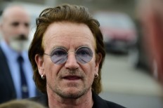 Bono says 'back to full voice', U2 tour will resume