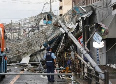 Powerful typhoon kills 9, shutters airport in Japan  