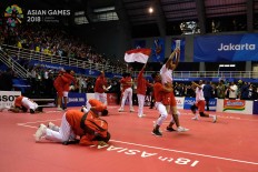 Indonesian players celebrate after winning gold in the sepaktakraw men's quadrant final during the 2018 Asian Games in Palembang on Sept.1. JP/ Jerry Adiguna 