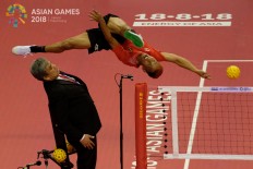 Indonesia's Herson Muhamad Saipul  jump for the ball in the sepaktakraw men's team regu match against Iran in Jakabaring Sport City, Palembang, August.19. JP/Jerry Adiguna 