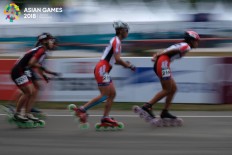Roller skater Li Mengchu of Chinese Taipei races in the 20-kilometer women’s rollerskating final at the 2018 Asian Games in Jakabaring Sport City in Palembang, South Sumatra, on August. 31. Li won the gold medal after setting a time of 44 minutes and 50.929 seconds. JP/Jerry Adiguna
