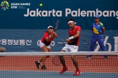 Benjamin Christopher Rungkat and Aldila Sutjiadi of Indonesia in action against Thailand during the mixed doubles tennis at the 2018 Asian Games in Palembang on August.25.  JP/ Jerry Adiguna