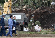 Japan PM visits quake-hit Hokkaido as toll rises to 42