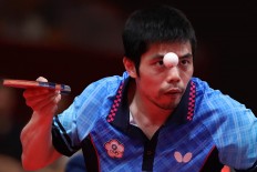 Chinese Taipei's Chihyuan Chuang keeps his eye on the ball in a men's table tennis match. JP/PJ Leo