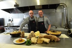 Former butcher Laurent Legoff (L) poses with the owner of 'The house of the tripe', Guillaume Delignou, on September 8, 2018, in La Ferte-Mace, western France.