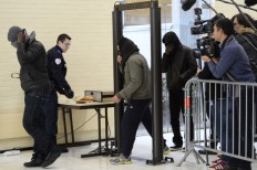 French police seek 4 men over gang-rape posted online