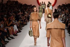 In Milan, Fendi and Prada dress strong women, Armani invades airport