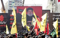 Supporters of Lebanon's Shiite movement Hezbollah gather near a giant poster of their leader Hassan Nasrallah during a ceremony to mark Ashura on September 20, 2018 in Beirut. Ashura commemorates the death of Imam Hussein, grandson of the Muslim faith's prophet Mohammed, who was killed by the armies of his rival Yazid over the succession for the caliphate near Karbala in 680 AD.
ANWAR AMRO / AFP
