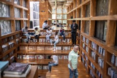 In this picture taken on September 15, 2018, people visit Liyuan Library on the outskirts of Beijing. 