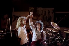 In this file photo taken on May 14, 1988 singer Robert Plant (L) and guitarist Jimmy Page perform during a Led Zeppelin reunion concert at Madison Square Garden in New York. Led Zeppelin found itself winding on down the legal road again on September 29, 2018 after a US appeals court ordered a new trial over claims the rockers copied part of 
