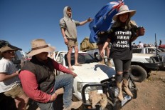 Beer and bull riding: Australian revelers celebrate the outback
